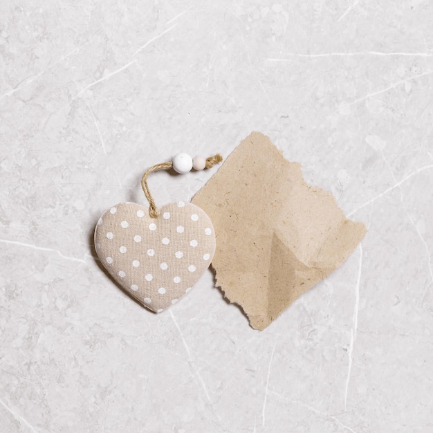 Valentines day concept toy hearts from linen cloth with gold color striped or dots on gray marble