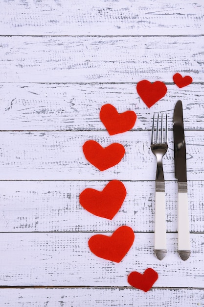 Valentines day dinner with table setting on wooden table close-up