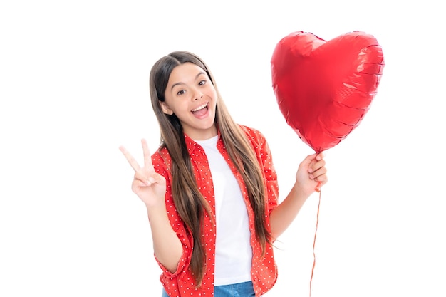 Valentines Day Dreaming cute teen child with red heart balloon Portrait of happy smiling teenage child girl