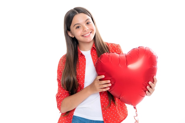 Valentines Day Dreaming cute teen child with red heart balloon Portrait of happy smiling teenage child girl