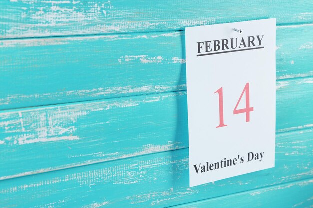 Valentines Day, February 14 on calendar on wooden background