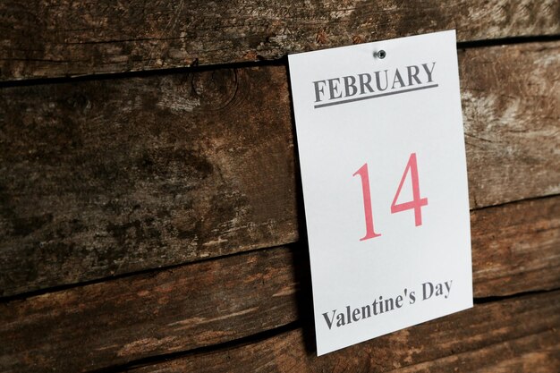 Valentines Day, February 14 on calendar on wooden background