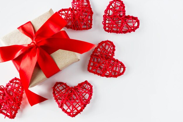 Valentines day gift and red hearts on a white background