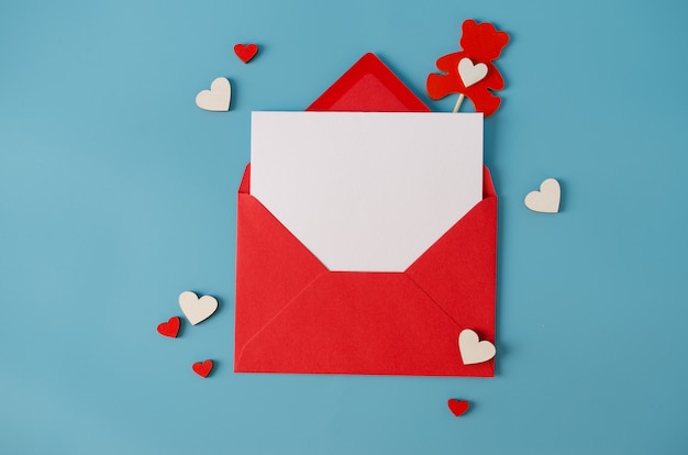 Valentines day greeting card. Red envelope with blank card. Top view with space for your greetings.