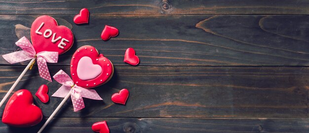 Valentines day heart shaped cookies on wooden table background with copy space.