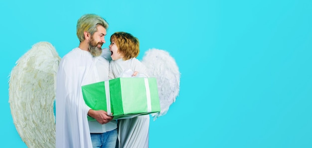 Valentines day little angel child boy and father in white wing with valentine present cute angels