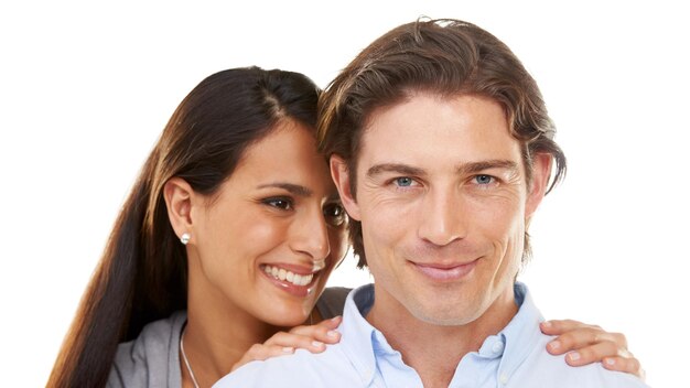 Valentines day love and couple on a date hugging in happiness and happy isolated in a studio white background Portrait lovers and man with woman for romance in a relationship together