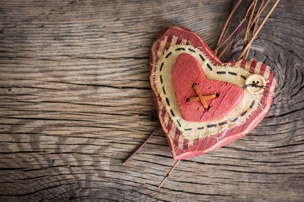 Valentines day ornament. Red hearts on wooden background. Greeting card blank