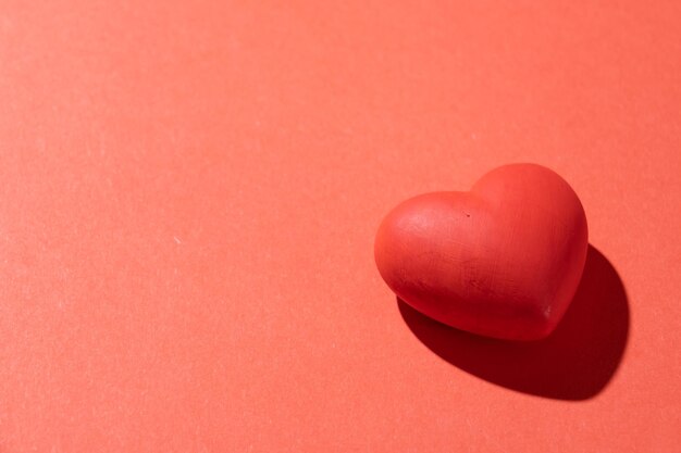 Valentines day red heart with copy space isolated on red