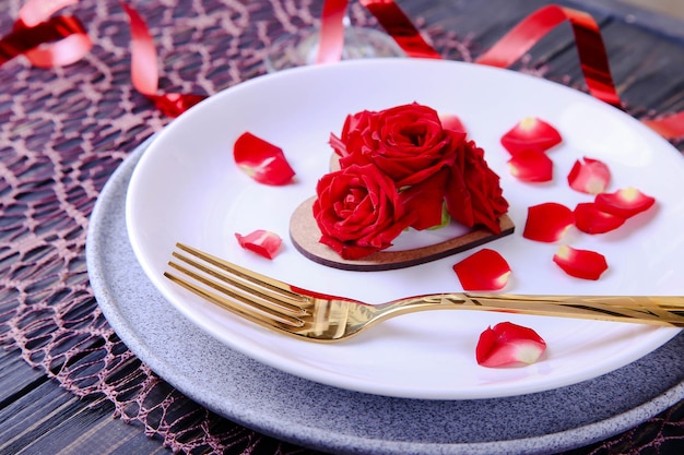 Valentines Day Serving Beautiful table setting with scarlet roses