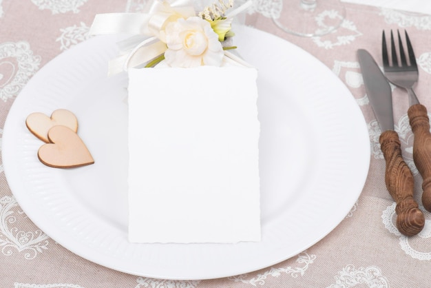 Valentines day table setting with gift and empty card for text