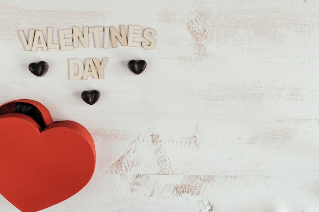 valentines day text with a heart box full of chocolates