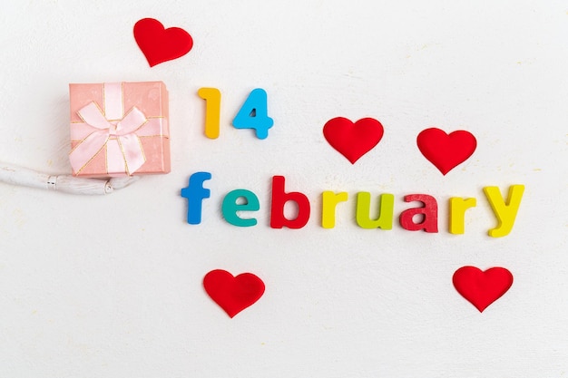 Valentines Day a white background A gift box with the inscription February 14 Top view