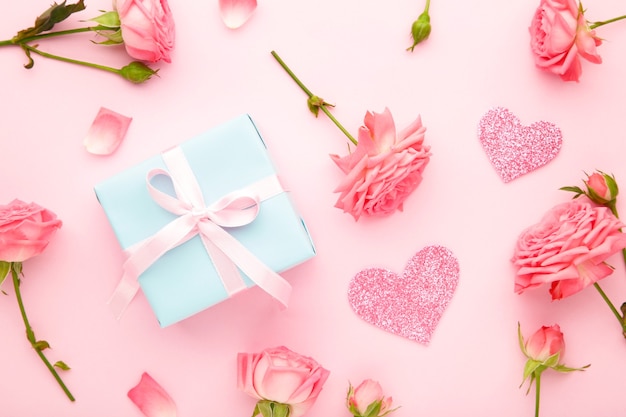 Valentines day with pink roses and gift box on mint