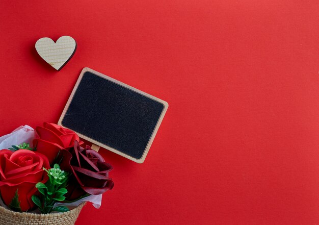 Valentines day wooden heart on red background