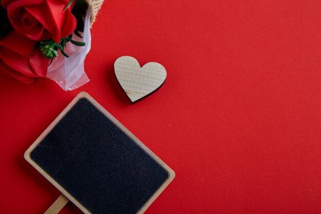 Valentines day wooden heart on red background