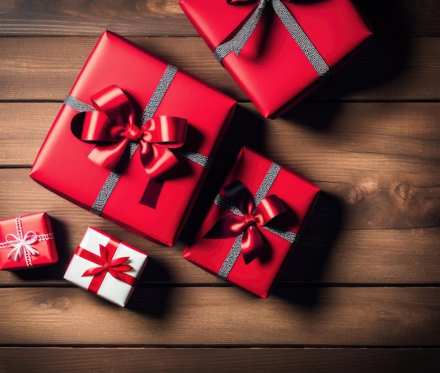 Valentines gift boxes and red ribbon on wooden background