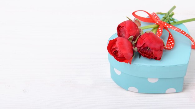 Valentines gift with red ranunculus on a white background, Celebration Valentine's day