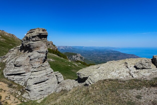 The Valley of Ghosts. Demerji. Green trees and bushes in the foreground. Crimea.