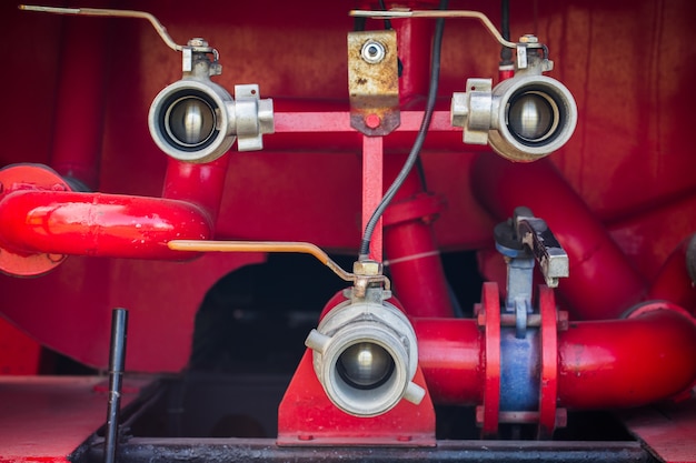 Valve of water pipe on red fire truck