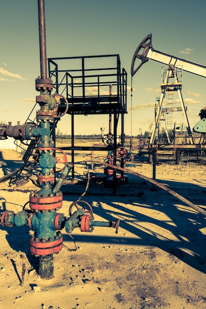 Valves armature of an oil well mouth. Oil and gas industry theme. Petroleum concept. Russia, Sibirea.