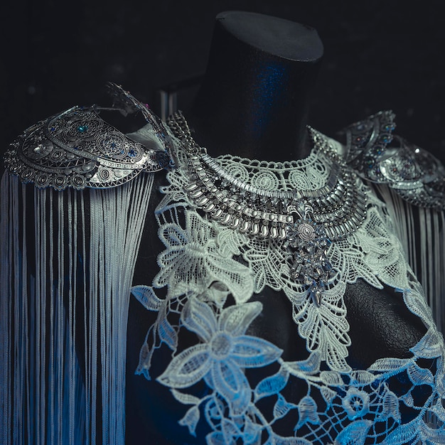 vampire, dress made with white lace and pieces of jewelry in silver and precious stones. costume in the style of romanticism of the nineteenth century. handmade