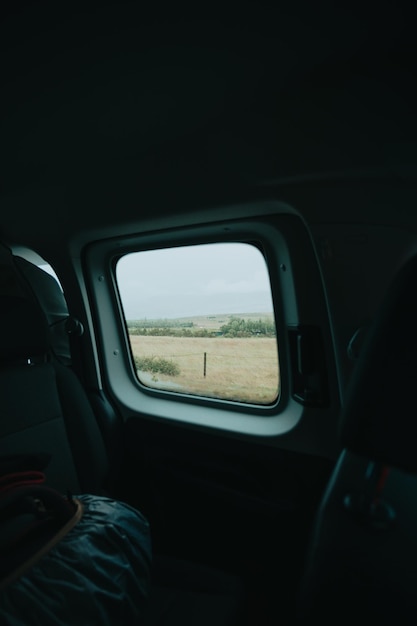 Van dashboard on the iceland road against a cloudy rainy day\
lifestyle travel tourism nature active life amazing cinematic\
scandinavian landscape travel on epic road trip through\
mountains