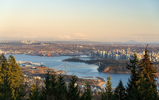 Vancouver city downtown panorama vancouver harbour marina\
aerial view at dusk lions gate bridge