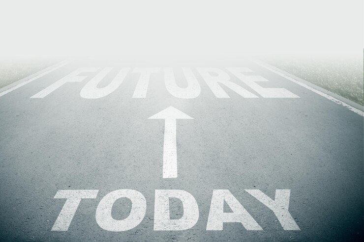 Vandaag naast de toekomst tekst op asfalt weg met witte pijl teken op de weg gaat in mist richting weg teken vooruit concept onduidelijk vooruit of negatief morgen concept