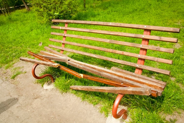 Vandalism broken bench in the park