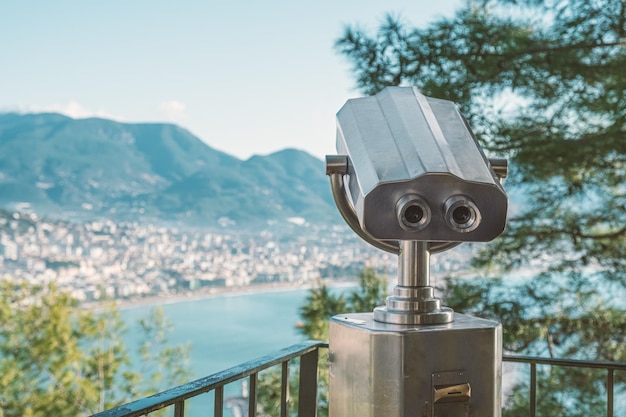 Vandalproof stationary binoculars with a coin acceptor in a tourist place