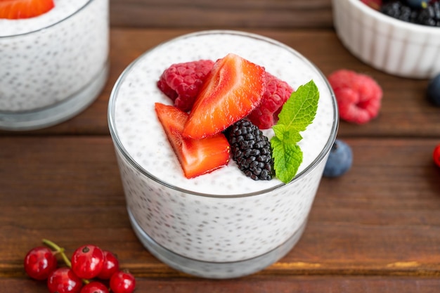 Vanilla chia pudding with fresh berries and honey in a glass Superfoods concept Copy space