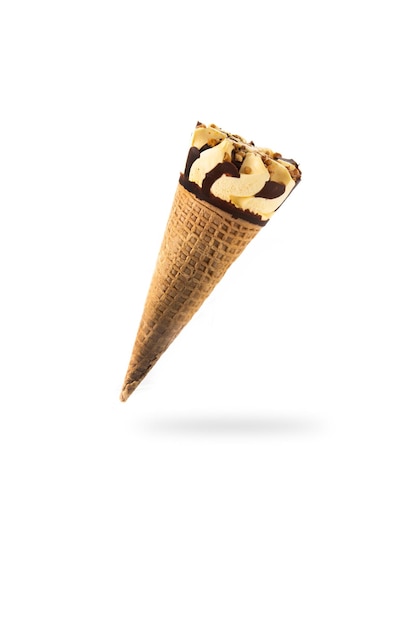 Vanilla and chocolate ice cream cone floating in the air