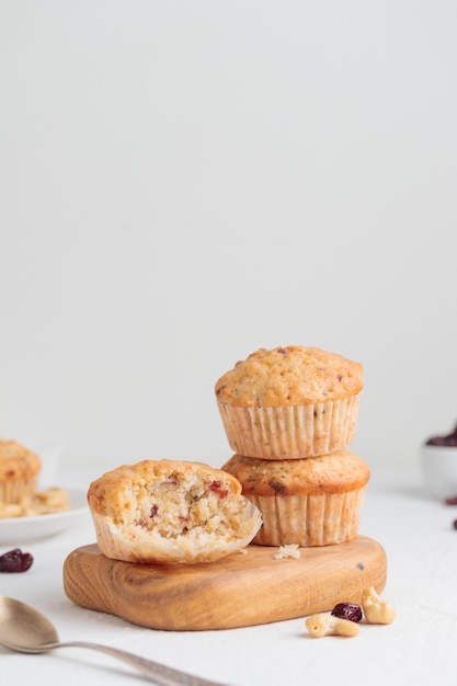 Vanilla fresh baked muffins with nuts and berries