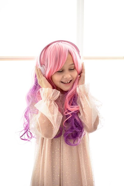 Vanilla Girl Kawaii vibes Little girl with pink hair have party in barbie style Listening music with headphones mobile phone