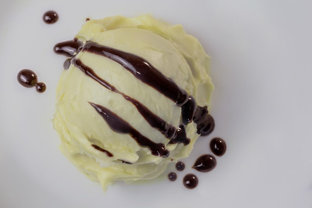 Vanilla ice cream ball with chocolate icing