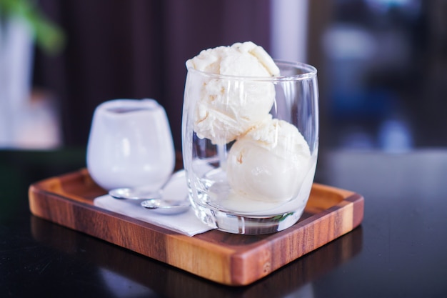 Vanilla ice cream is placed in a clear glass