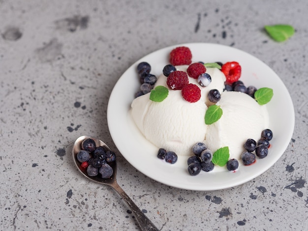 Vanilla ice cream sundae with fresh summer berries