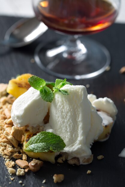 Vanilla Ice cream in transparent cup with rum