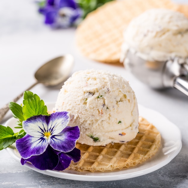 Vanilla ice cream with edible flowers