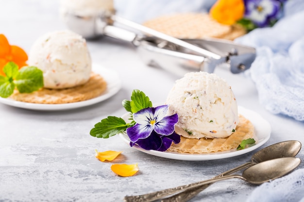 Vanilla ice cream with edible flowers