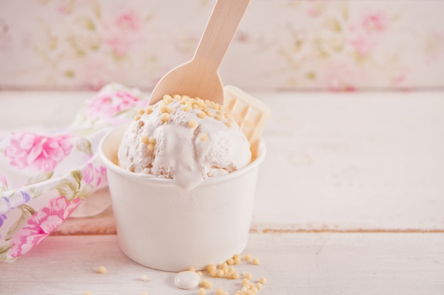 Vanilla ice cream with white chocolate on the white table 