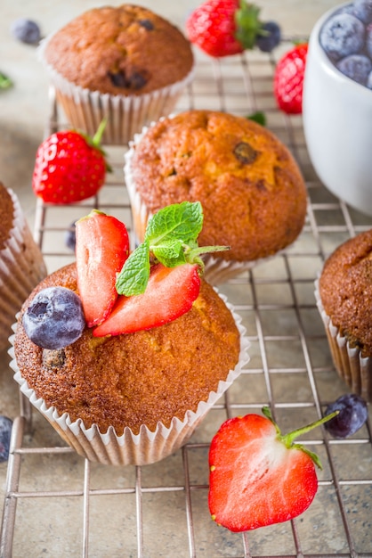 Vanilla muffins or cupcakes with berries