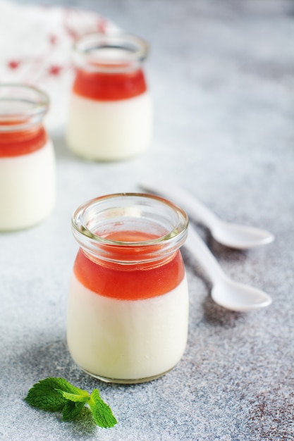 Vanilla panna cotta and fresh strawberry, mint leaves