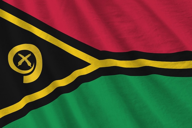Vanuatu-vlag met grote plooien die dicht omhoog zwaaien onder het studiolicht binnen de officiële symbolen en