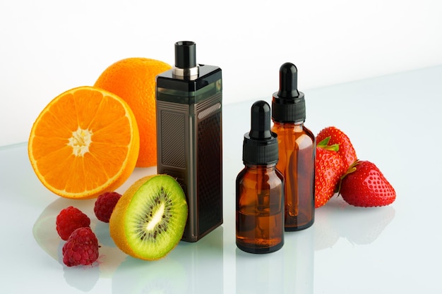 Vape and smoking liquid with fruit flavor on white background