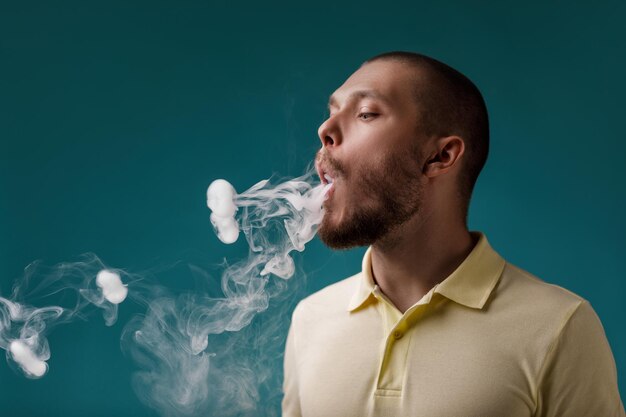 Vaping man launches ring of the smoke