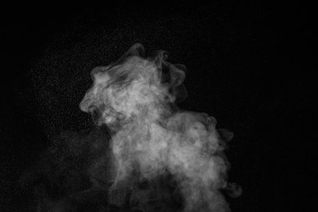 Vapor steam rising over black background Splashes and drops of water Curly white steam rising up and splashing water