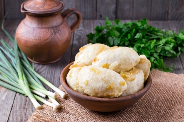 Vareniki or Russian dumplings with onion