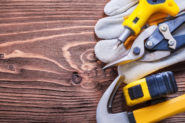 Variation of house improvement tools on vintage wood board\
construction concept